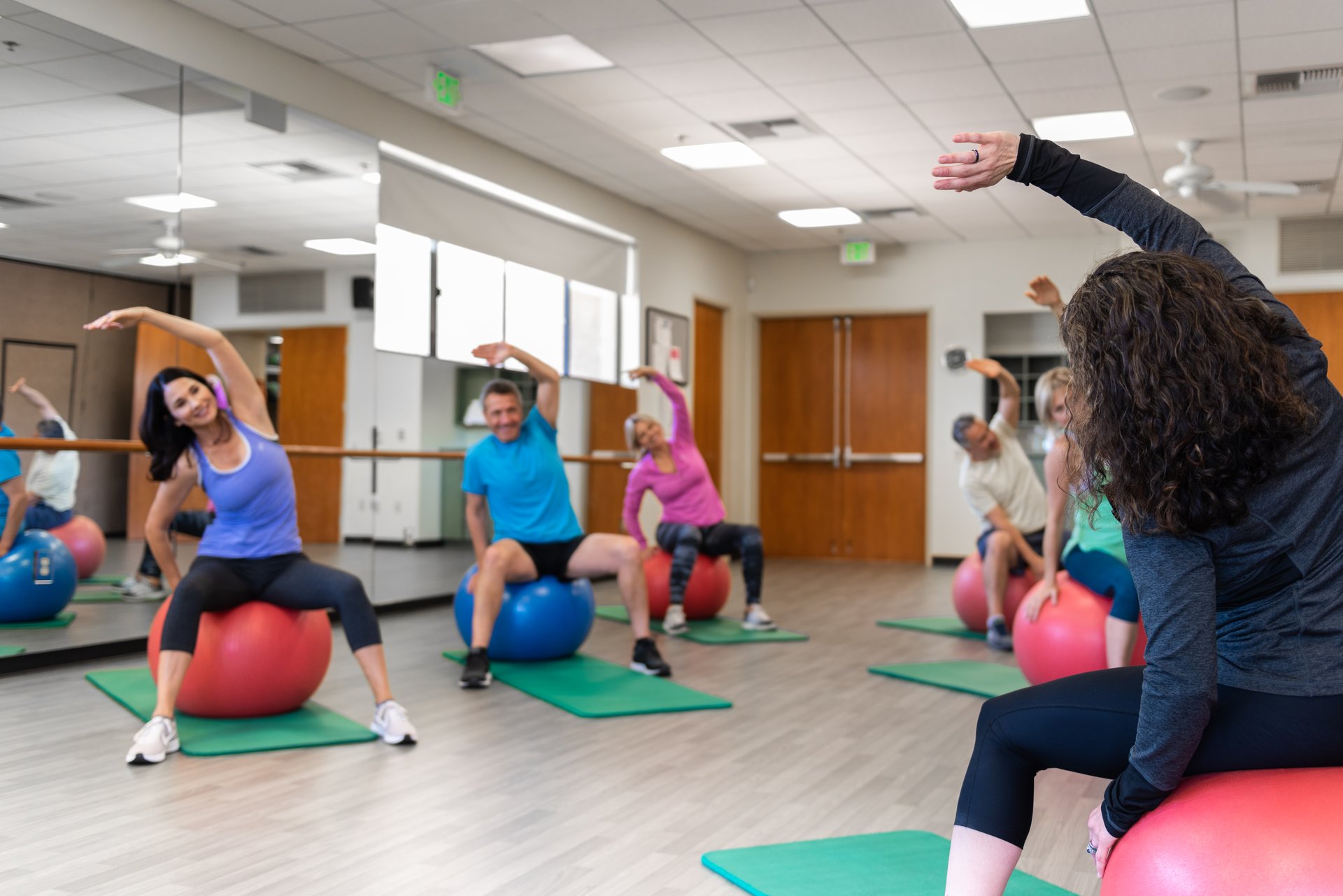Members participating in a group fitness class at The Springs Country Club fitness center in Rancho Mirage.