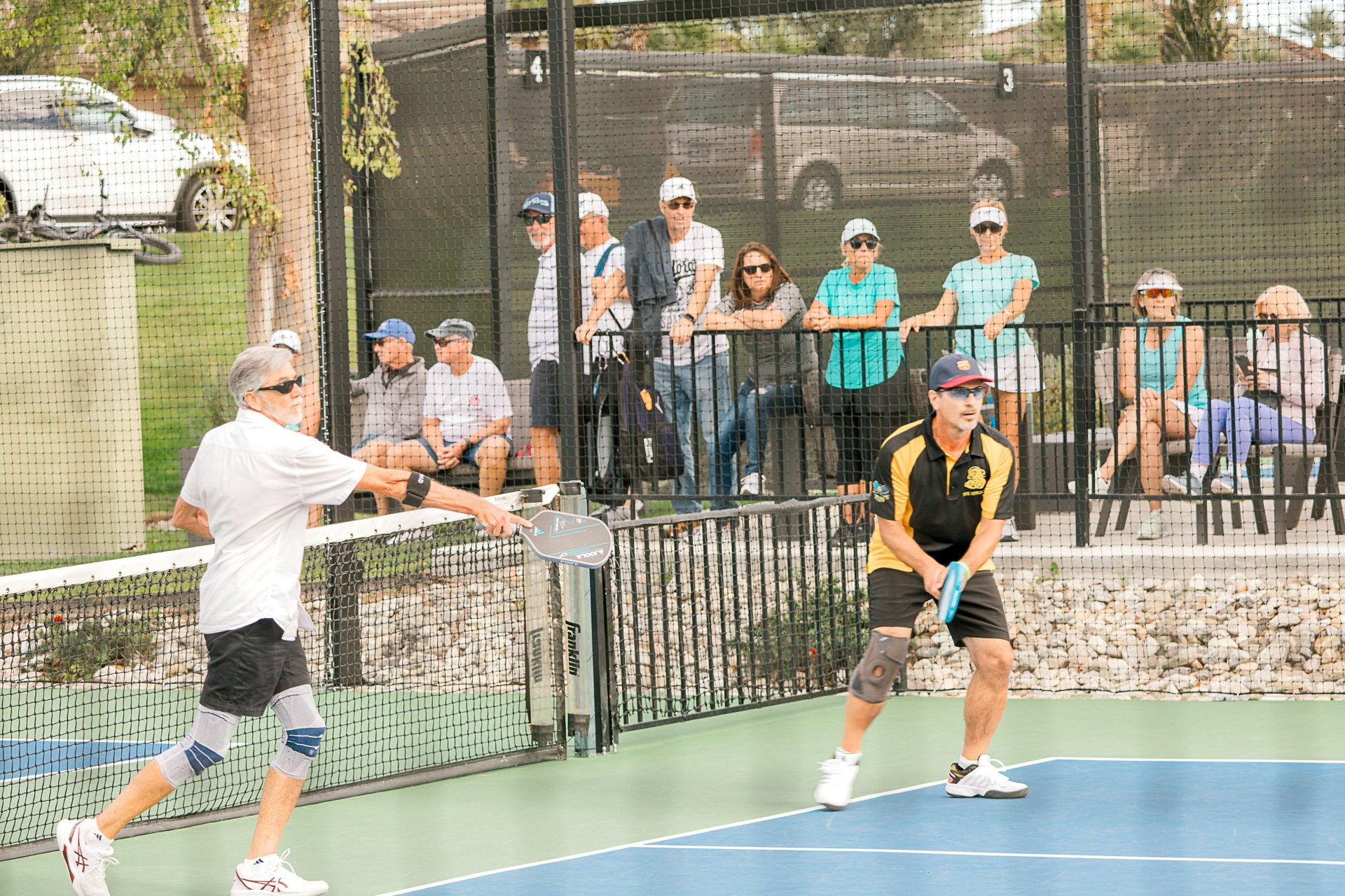 Pickleball players enjoying a drop in morning game at The Springs Country Club courts in Rancho Mirage.